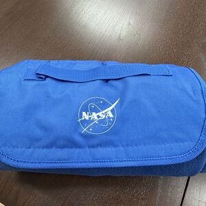 One NASA blanket, it rolls up and velcros together